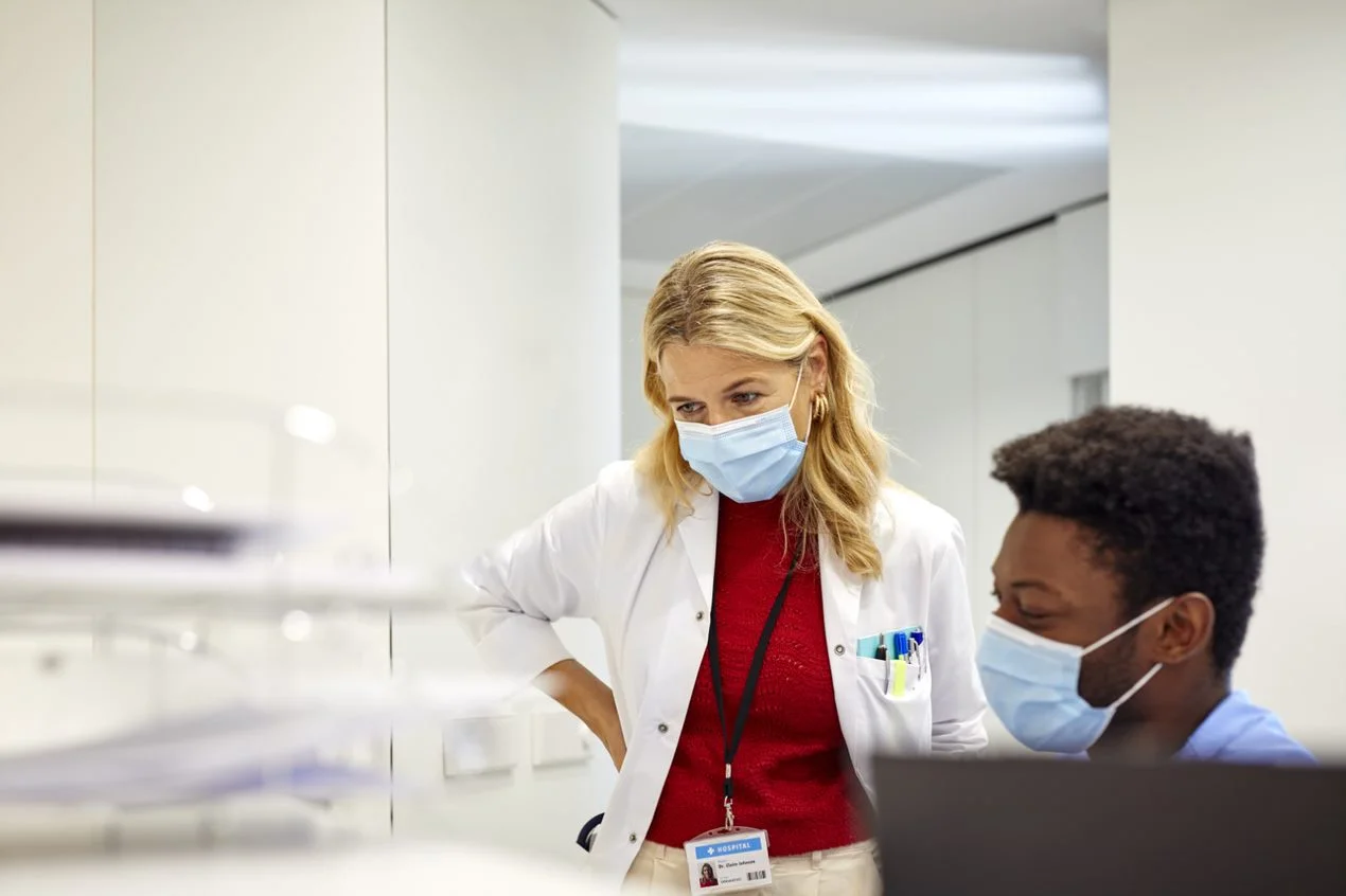 a doctor looking at a patient